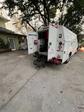 Magnet Plumbing service vehicle on-site for Grease Trap Cleaning in Wilshire Heights